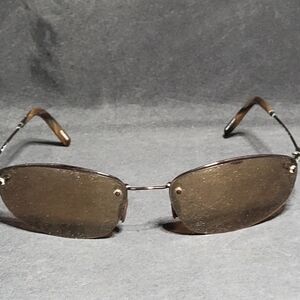 Pre-owned Tommy Bahama TB900SP rimless sunglasses in good used condition. Frames
